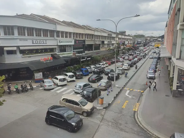 Restaurants and shops along a street in Bangsar Baru.