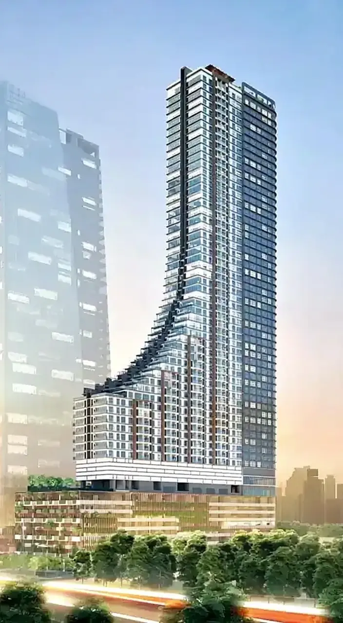 The Khaya Residences tower on Jalan Bangsar, a curved stepped facade rising 61 storeys.